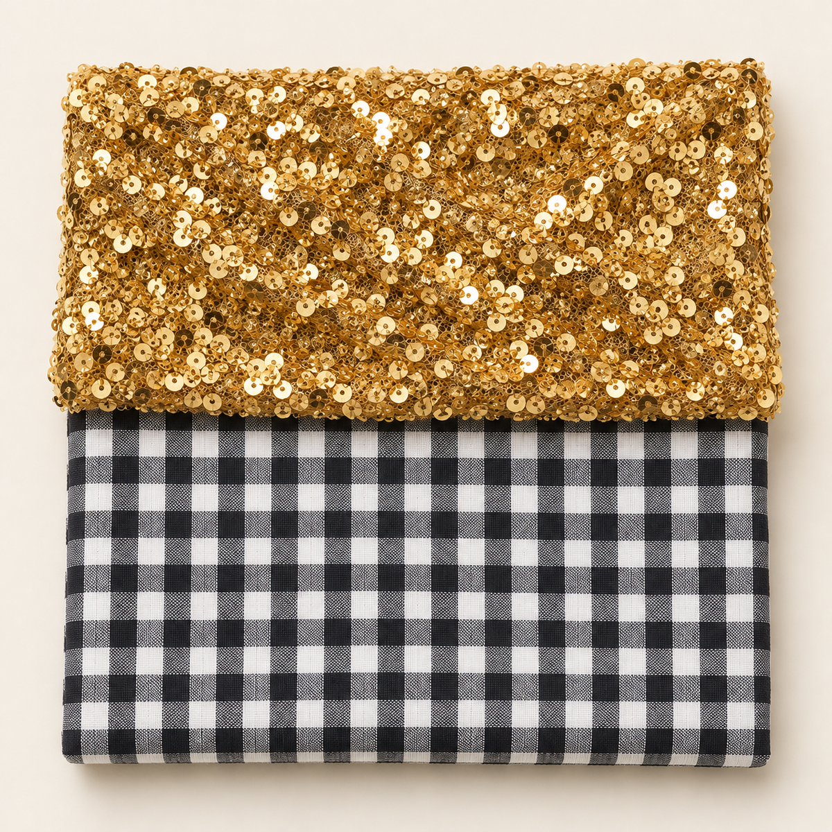 Gold sequins above black and white gingham fabric