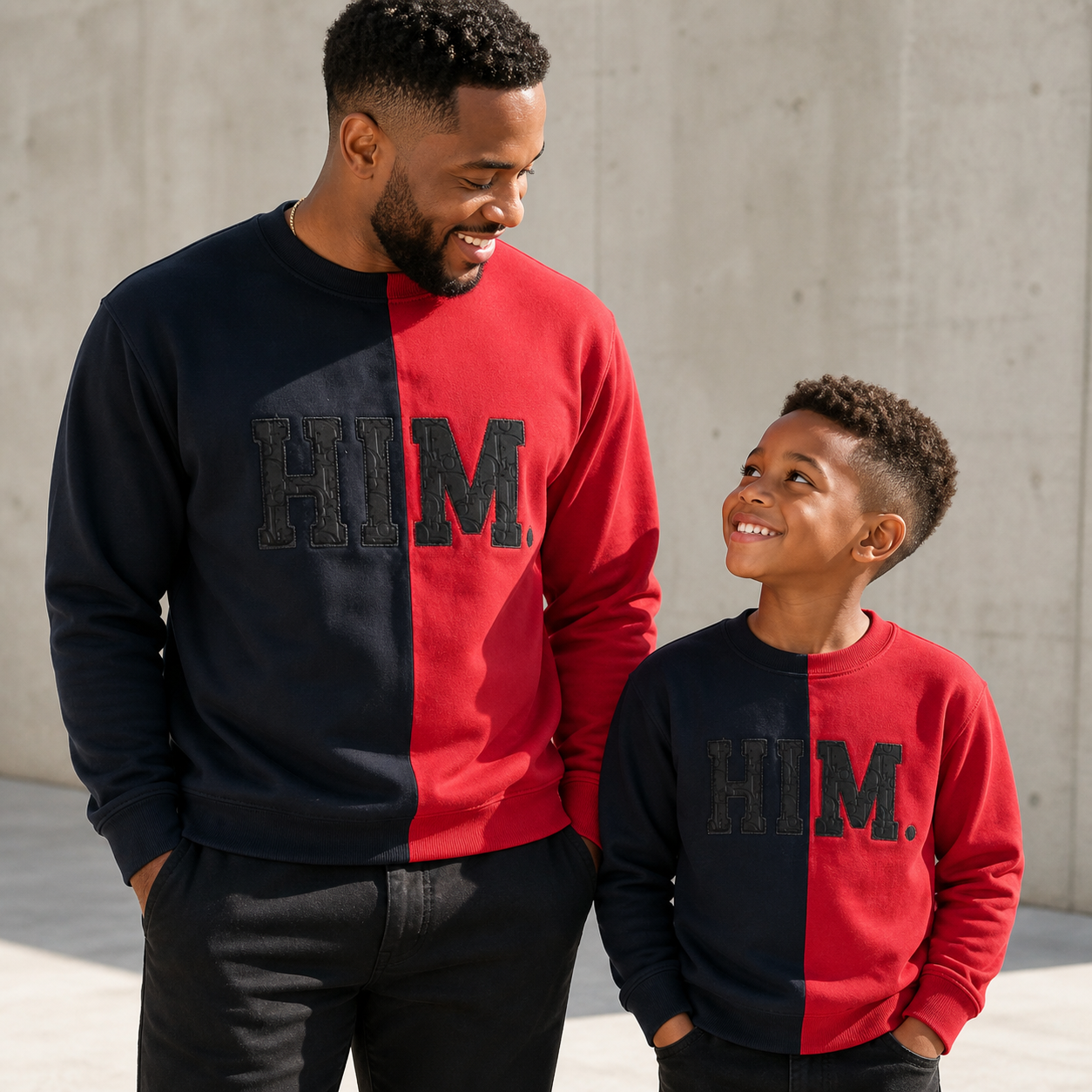 Adult and child wearing matching HIM crewneck sweatshirts