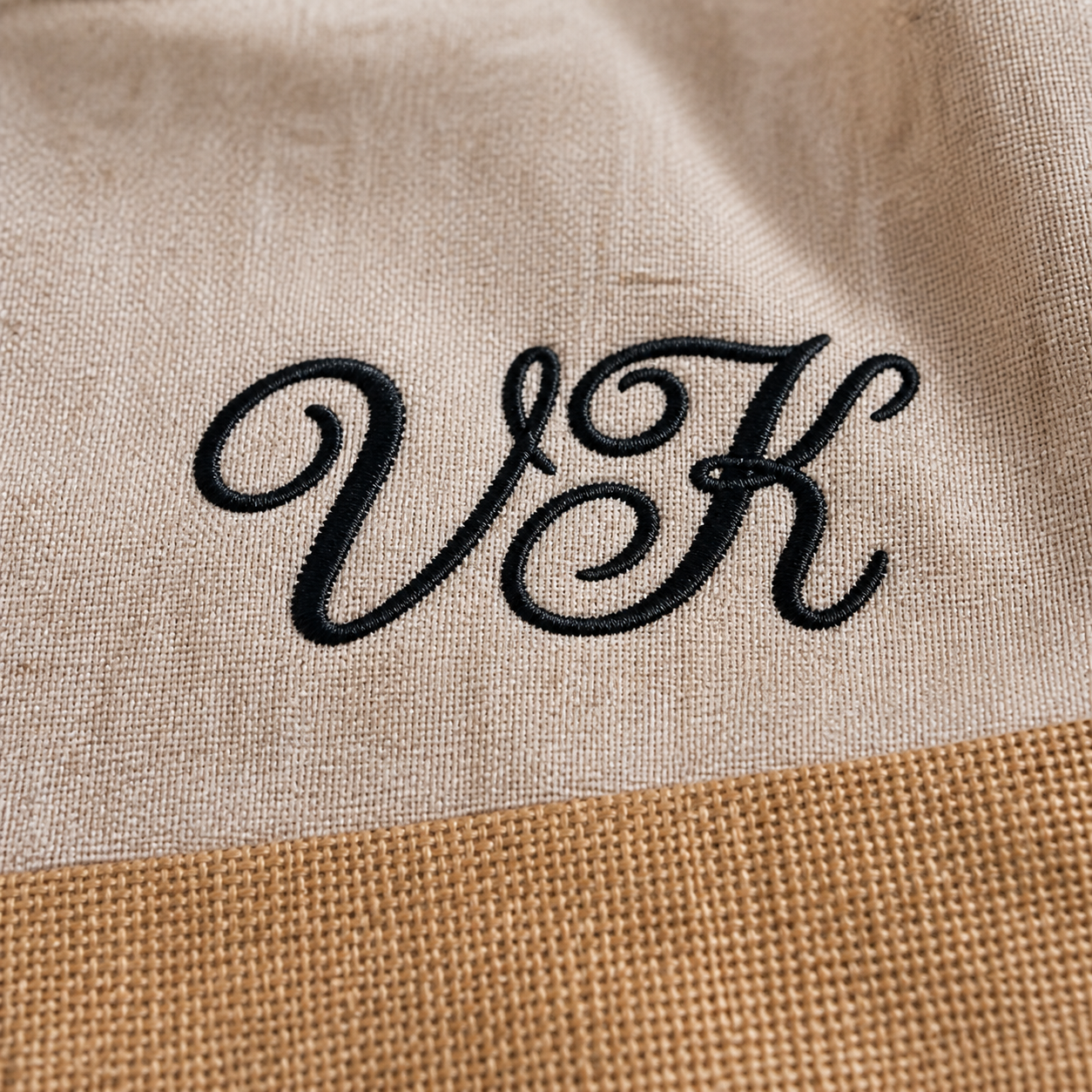 Close-up of personalized embroidery on jute tote