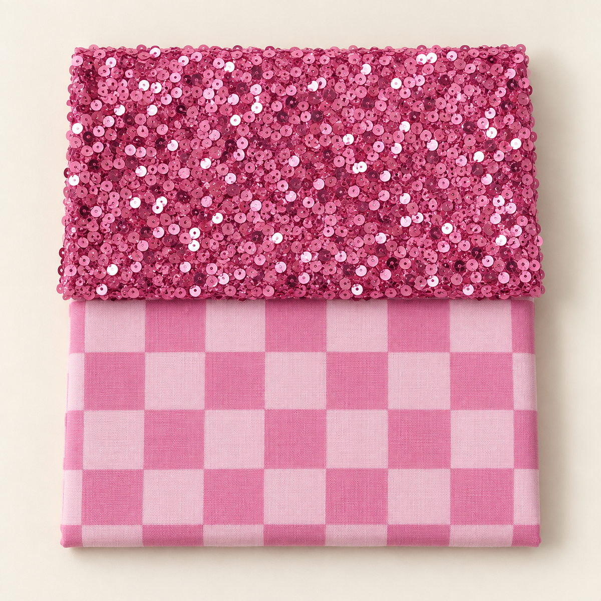 Pink sequins above pink checkerboard fabric